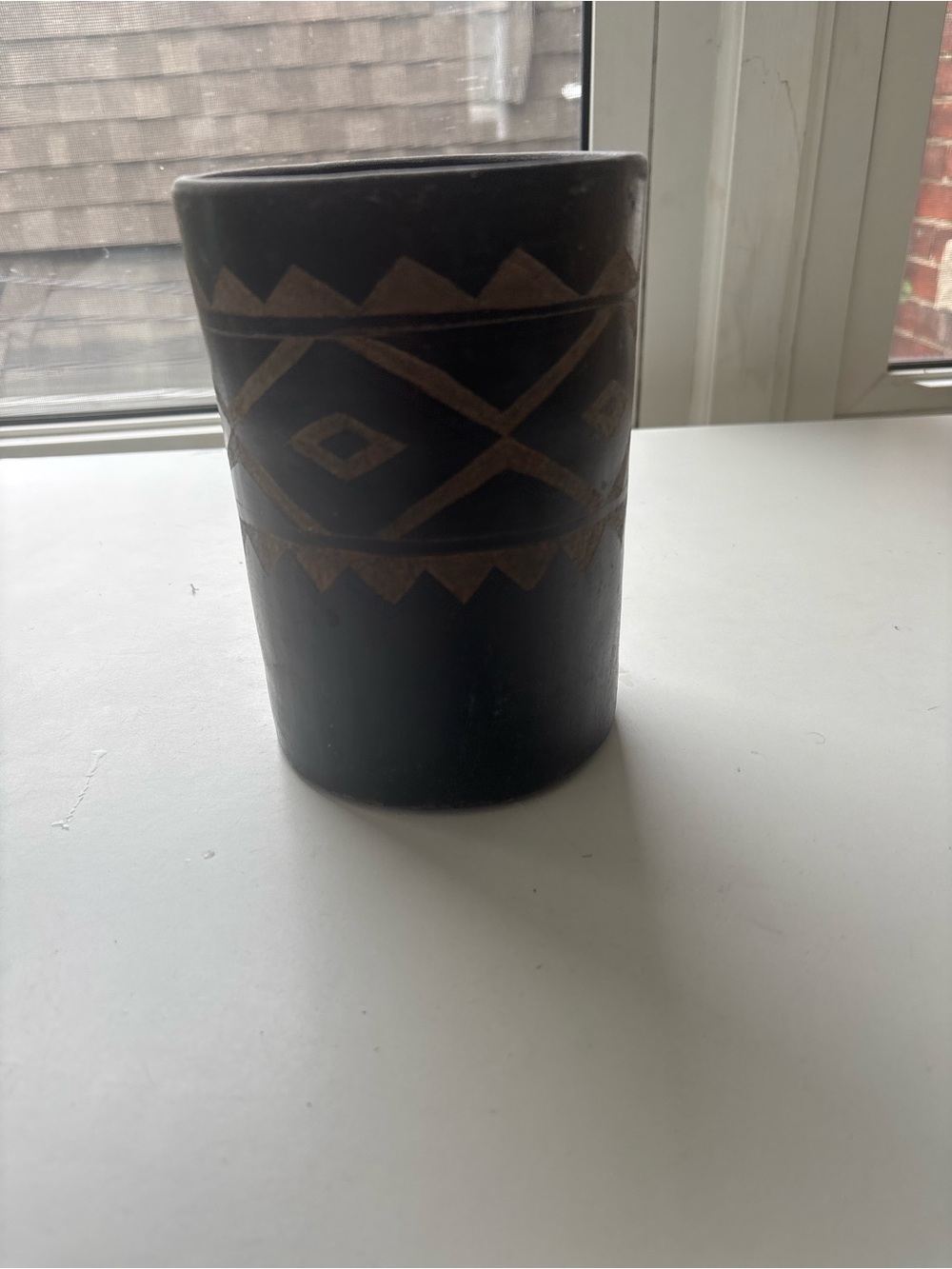 Handcrafted Black Wooden Decorative Cylinder with Geometric Accent